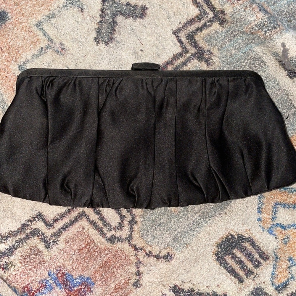 Evening black satin bag with hidden chain